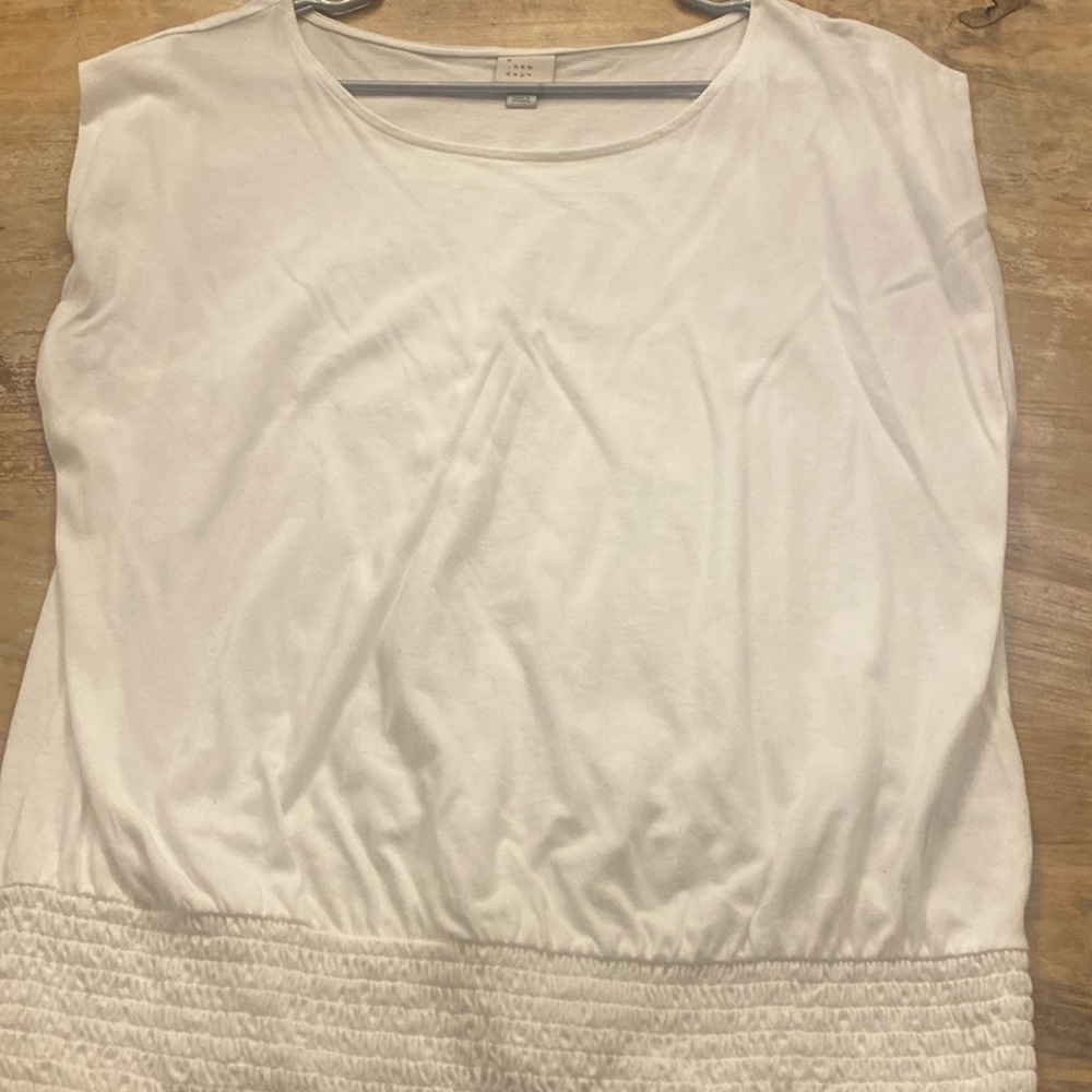 NWOT cap sleeve white shirt with elastic waist. Size L. Brand- a new day